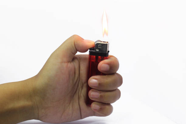 istock Hand holding burning a gas lighters 1488320122
