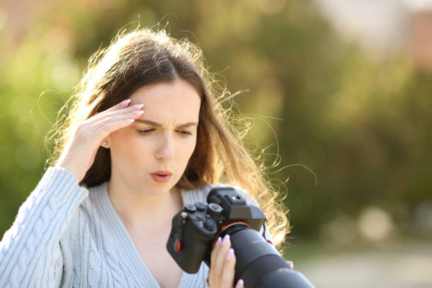 istock Worried photographer checking photos on camera 1488320226