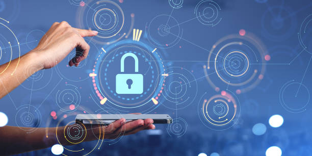 istock Businesswoman holding smartphone with digital interface with padlock 1488320351