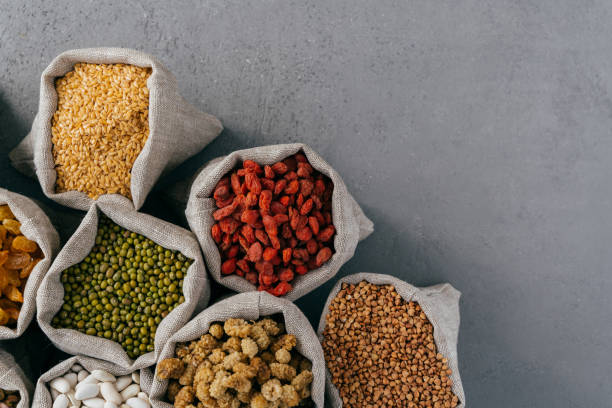 istock Sacks with red goji, buckwheat, Jerusalem pea, mulberry, kidney bean isolated over grey background with copy space for your information 1488321412