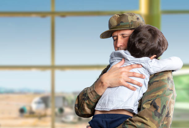 istock Military father hugs his son 1488321603