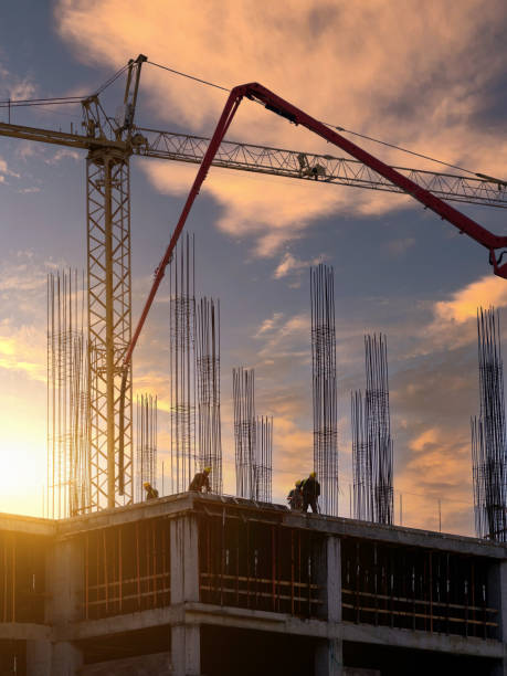 istock Workers prepare the foundations for pouring concrete on the floor. Construction of a new residential building. 1488322449