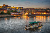 Tourboat on Vltava River and Cityscape of Prague