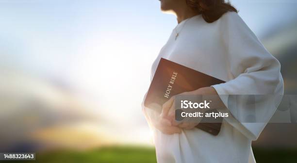 Christian Evangelism Concept Background With Church Holding Holy Bible Stock Photo - Download Image Now