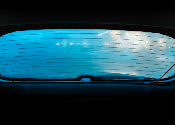 istock View through a fogged and rain-soaked car window with backlight 1488326632