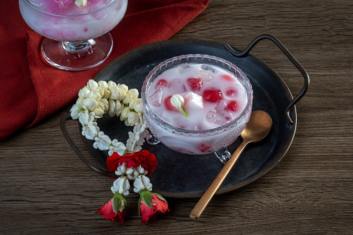 Thai traditional dessert Crispy Ruby in coconut milk.