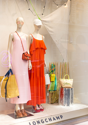 Lyon, France: Summer fashions (bright maxi dresses) in a shop window at Max Mara near the Place des Jacobins in the 2nd arrondissement.