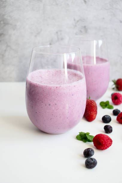 istock Cocktail with milk, ice cream and berries. On a white background. 1488331993