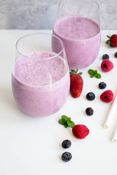 istock Cocktail with milk, ice cream and berries. On a white background. 1488332019