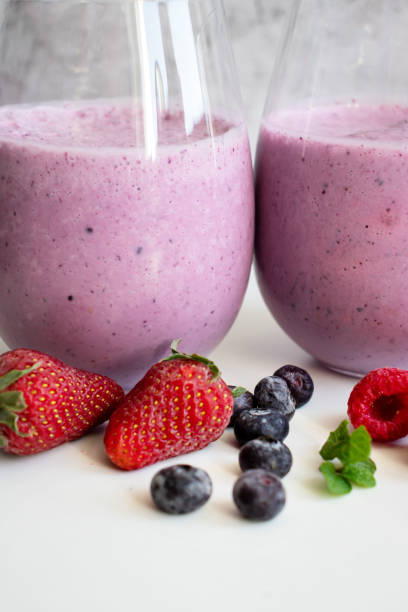 istock Cocktail with milk, ice cream and berries. On a white background. 1488332036