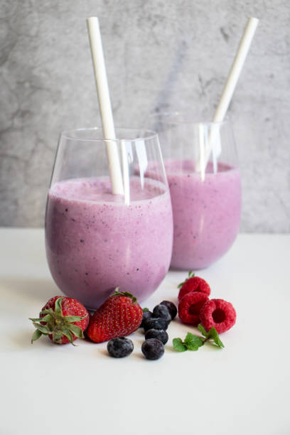 istock Cocktail with milk, ice cream and berries. On a white background. 1488332038