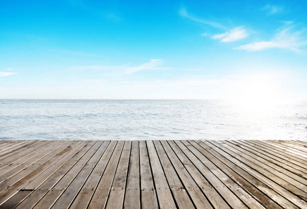 Wooden deck at the seaside stock photo