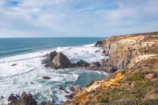 istock Typical scenery on the Atlantic coast. High rocky cliffs with sandy beaches in Odemira region, western Portugal. Wandering along the Fisherman Trail, Rota Vicentina 1488333243