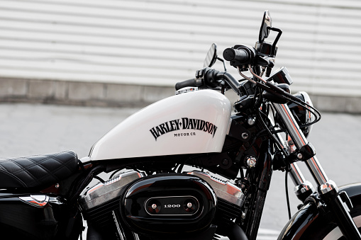 Minsk, Belarus, May 2023 -  Harley-Davidson logo on motorcycle.  Vintage style racer motorcycle with details.