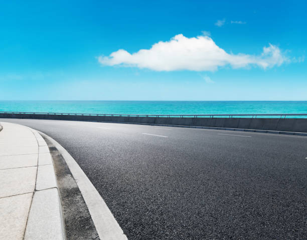 istock Empty asphalt road and beautiful sea landscape 1488333462