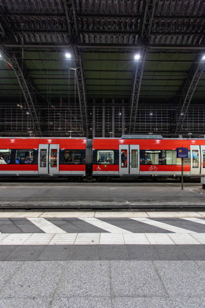 istock Local train standing on a platform at Cologne Central Station, Germany 1488333699