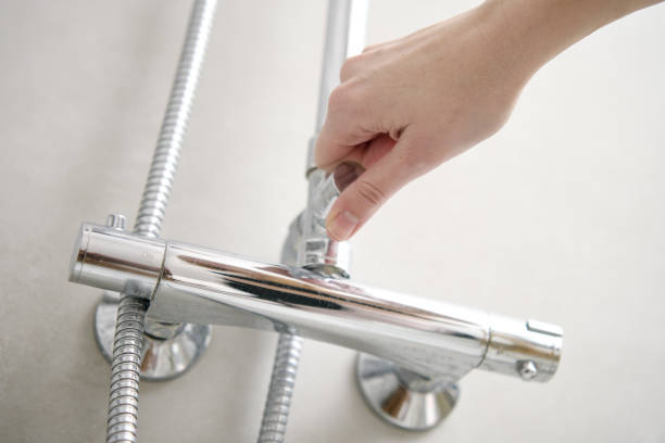 istock Woman use shower in bathroom 1488333958