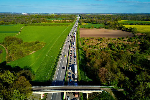 Traffic jam on A4 motorway in Poland due to an accident. Cars and trucks stopped on highway, aerial view