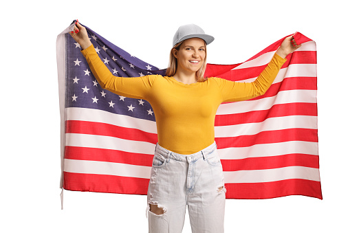 Happy gen z female holding a USA flag isolated on white background