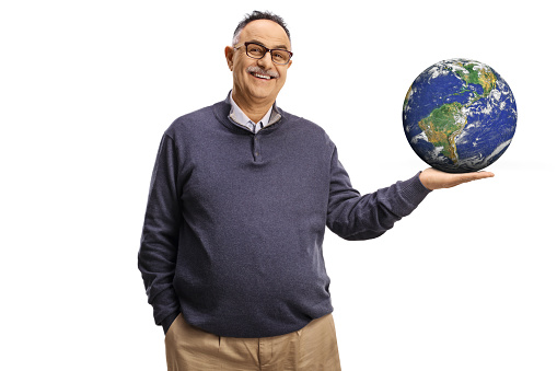 Smiling mature man holding the planet earth on his hand isolated on white background