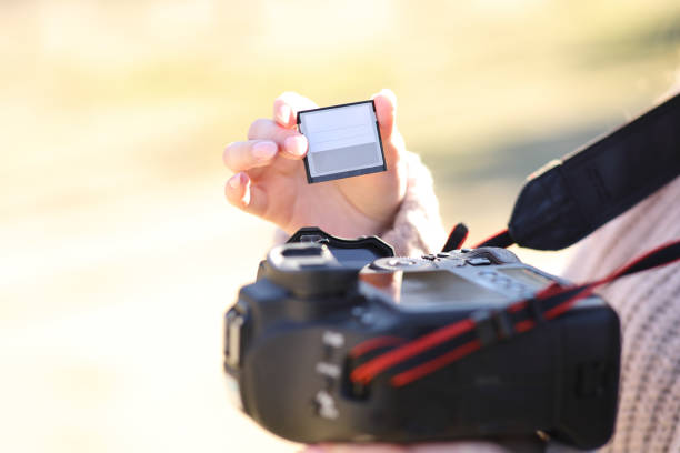 istock Photographer changing card on dslr camera 1488341305