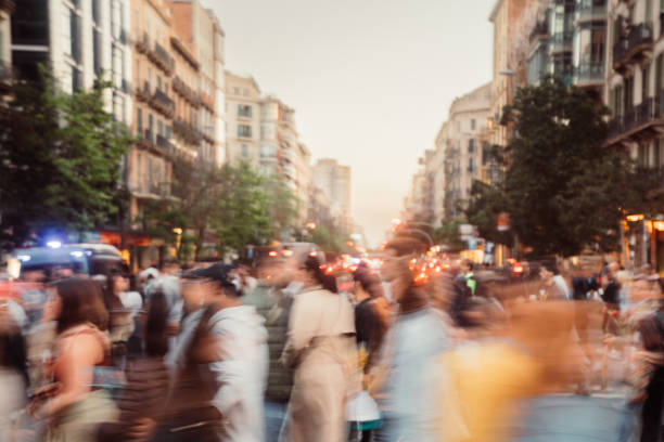 istock Crowd of people walking at zebra crossing. 1488342607