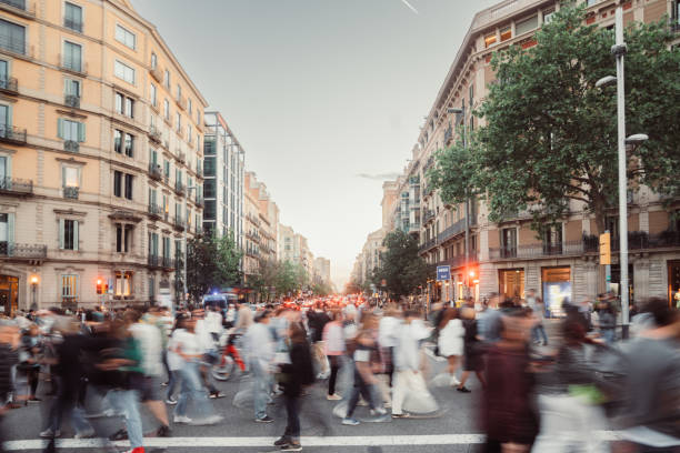 istock Crowd of people walking at zebra crossing. 1488342609