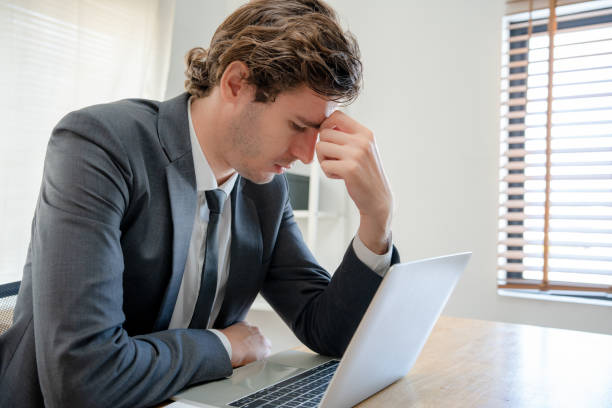 istock Young businessmen are tired and stressed from working by computer. Man has headache, eye strain, blurry vision, Migraine,office syndrome problem. 1488342694