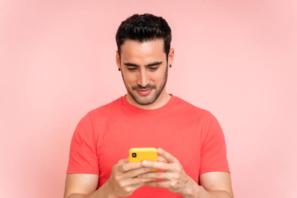 istock Concentrated man texting with mobile phone. 1488342910