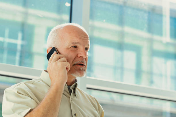 istock old man phones with a mobile phone 1488343146