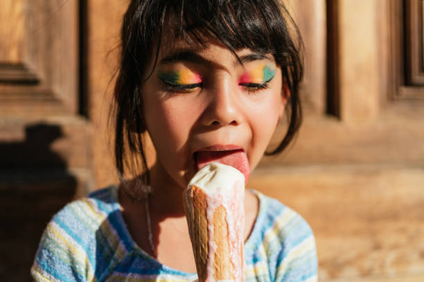 Girl eating an ice cream stock photo