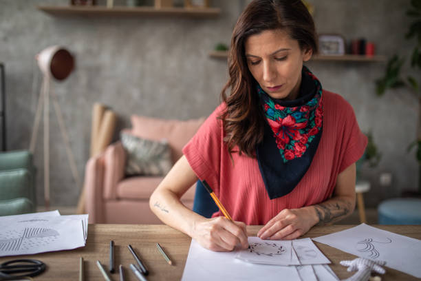 istock Woman working on a design at home 1488345769