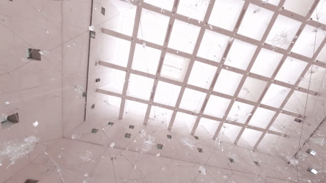 Drone flight first person POV modern sculpture scattered shards of glass
