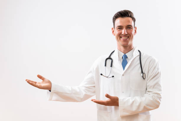 istock Doctor showing showing welcome gesture 1488346945
