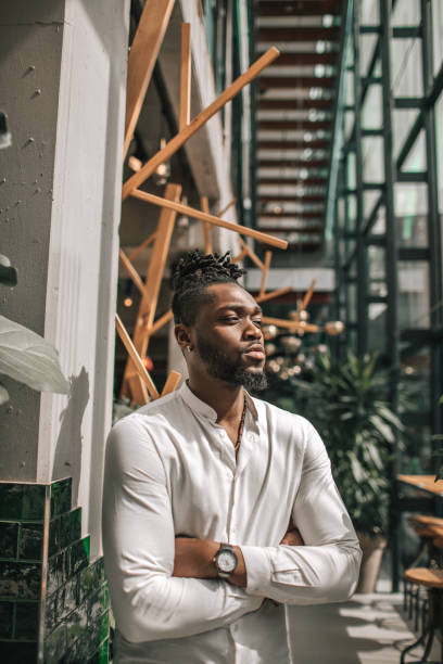 istock Handsome diverse black man in a green eco dutch cafe 1488347885