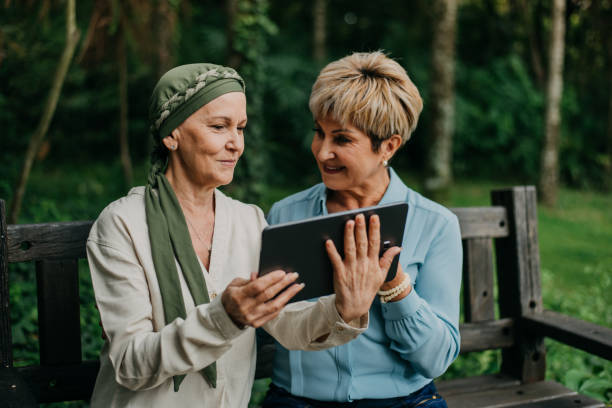 istock Friends, cancer patient using digital table 1488350396