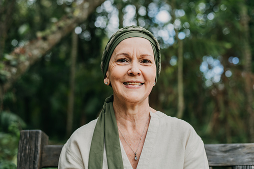 Portrait of woman with cancer wearing head scarf