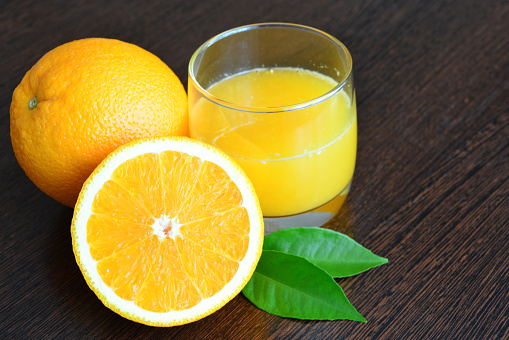 Orange Juice with fresh orange isolated on white (excluding the shadow)