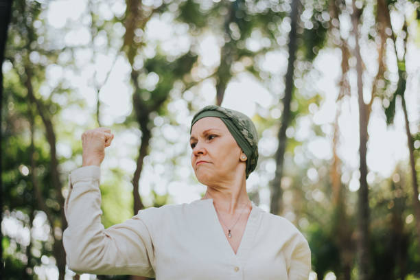 istock Woman with cancer shows strength 1488351365
