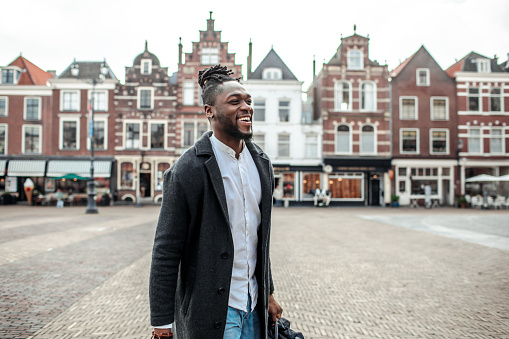 Portrait of a handsome black man in a dutch street