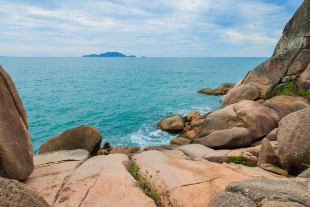 istock Coastline with granite rocks and turquoise ocean. 1488352931