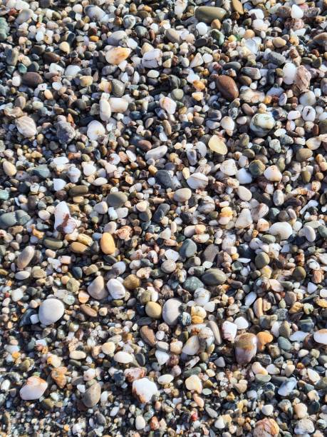 istock texture of small stones of a beach 1488352977