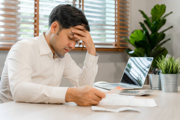 istock Young businessmen are tired and stressed from working by computer. Man has headache, eye strain, blurry vision, Migraine,office syndrome problem. 1488353099