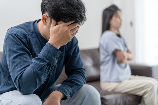 Asian man are disappointed and saddened after an argument with wife. Asian couples are having family problems resulting in divorce. Lover broken and Love problem