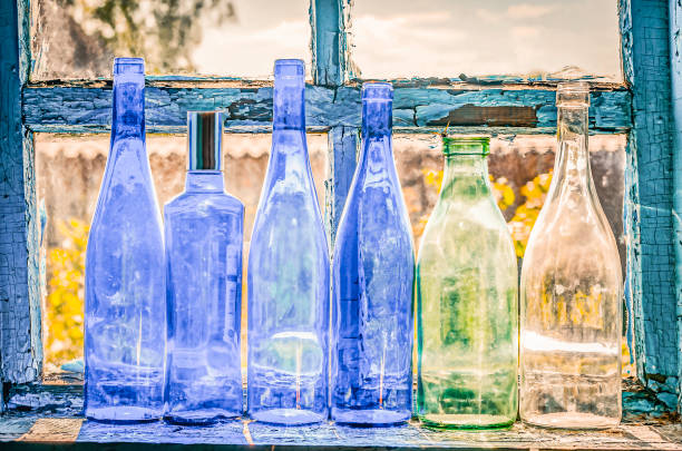istock blue empty bottles on window in old house 1488355559