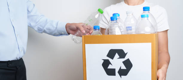istock Volunteer keep plastic bottle into paper box at home or office. Hand Sorting Recycle garbage. Ecology, Environmental, pollution, Dispose recycling, waste management and trash Separation concept 1488357978