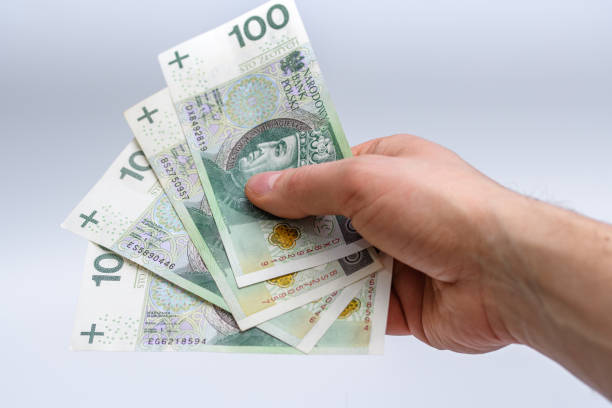 istock Polish money held in hand 1488358026