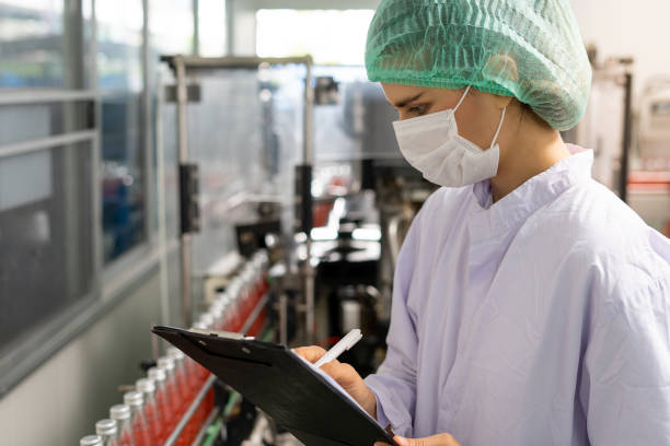 istock A tech expert or inspector is taking notes on the clipboard to verify orders on the food factory production line. Production control workers 1488358586