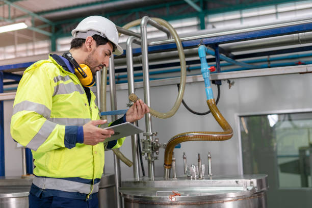 istock Machine engineers inspect machines and sterilizers in food factories or factory drinking water plants. Machine maintenance 1488358708