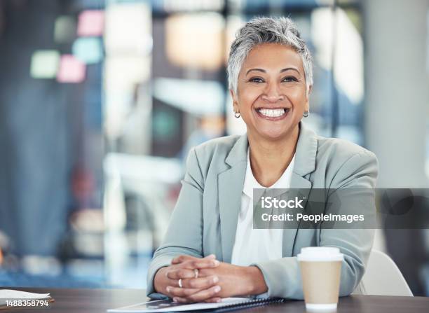 Ready Business And Portrait Of A Woman In Corporate For Working Success And Goals Smile Happy And Mature Office Employee Sitting At A Desk To Start Work In The Morning At A Legal Company Stock Photo - Download Image Now